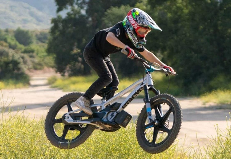 kid driving an electric bike